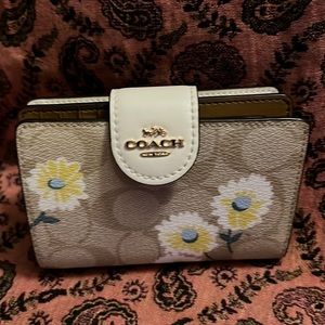 This is a flower coach wallet